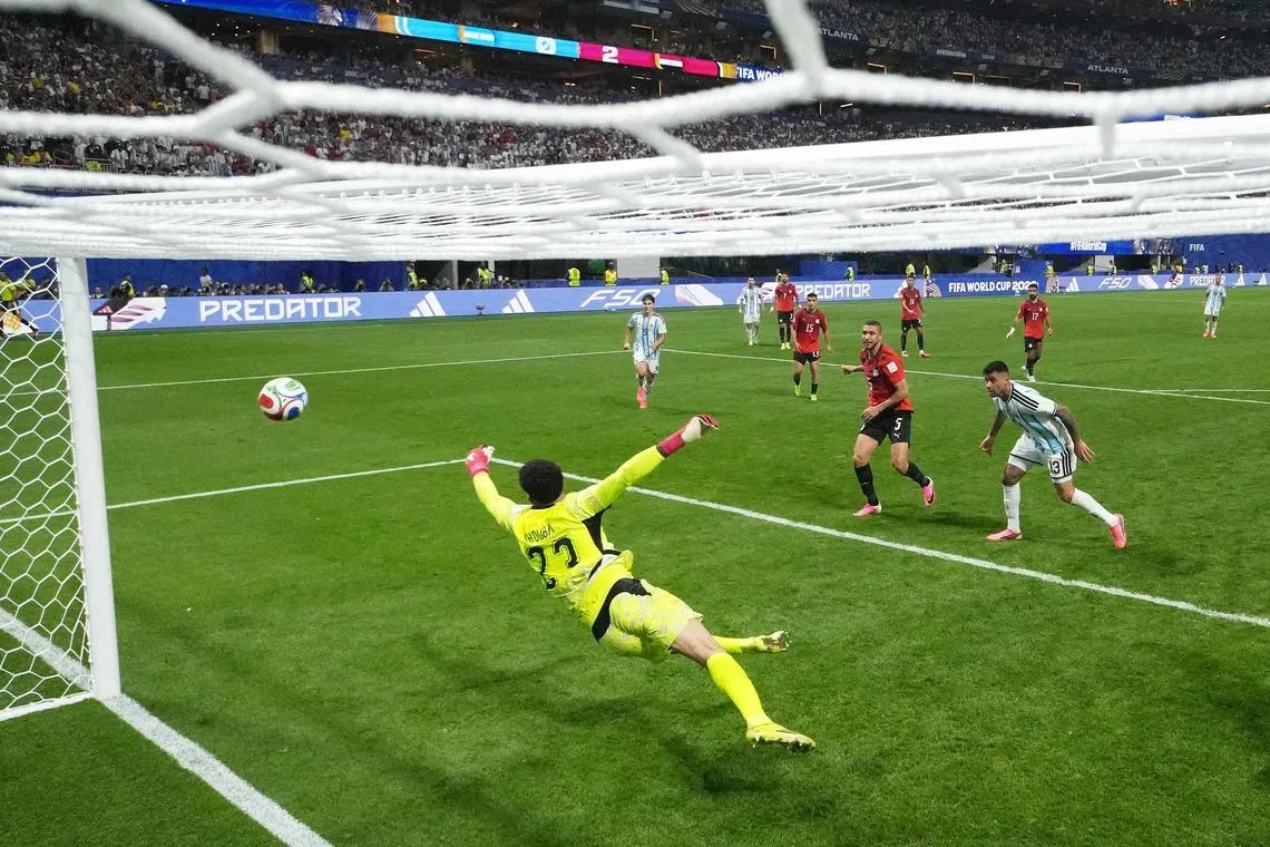 Cristian Romero #13 of Argentina scoring the team’s first goal.