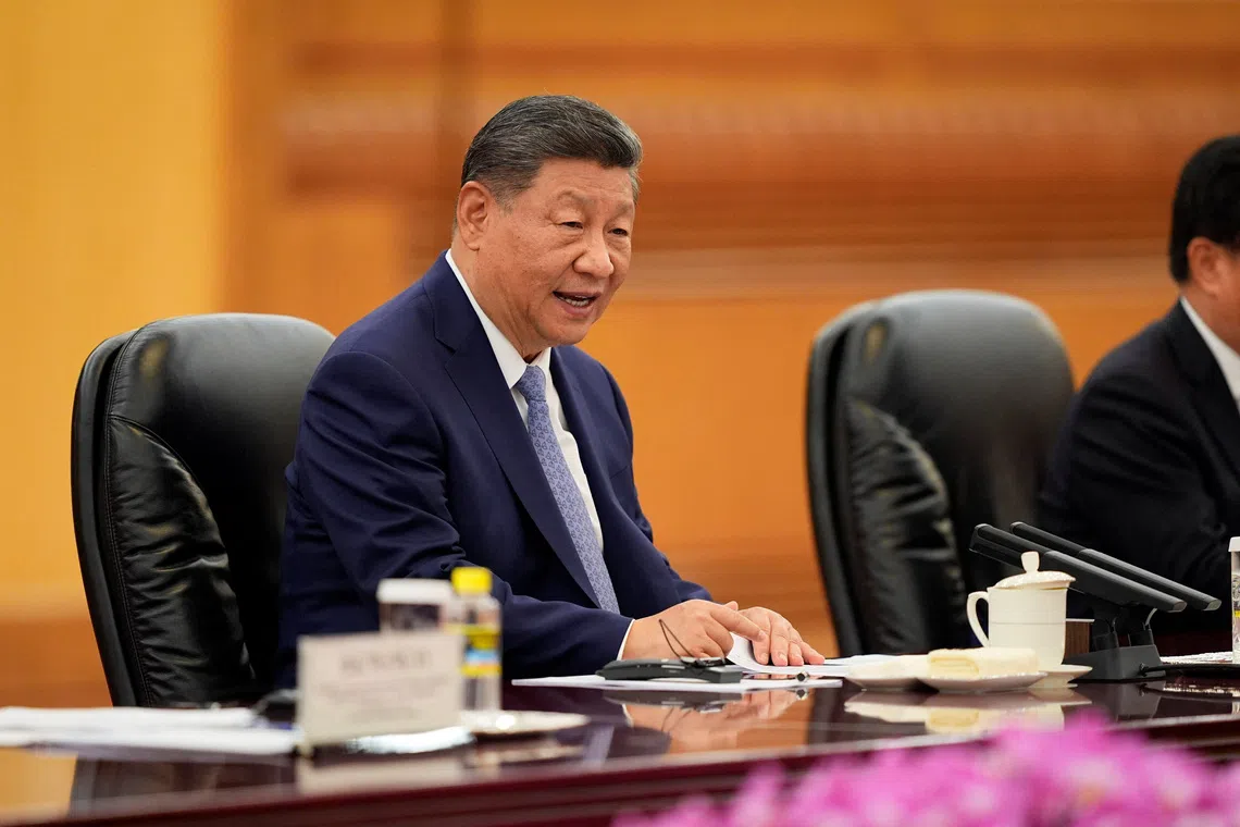 Chinese President Xi Jinping speaks during a meeting with Sri Lanka's Prime Minister Harini Amarasuriya (not pictured) at the Great Hall of the People in Beijing, China, October 14, 2025.  Ichiro Banno/Pool via REUTERS