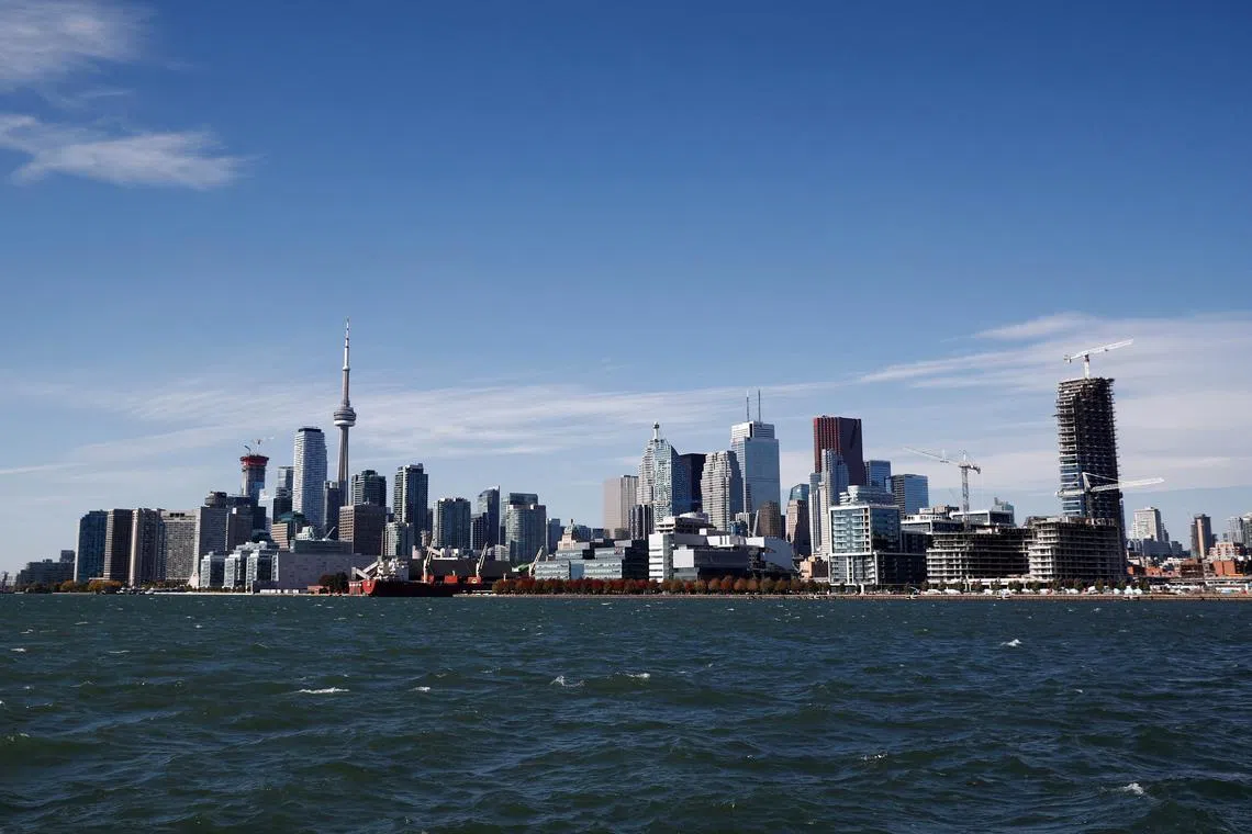 FILE PHOTO: Toronto skyline stands on the waterfront n Toronto, Ontario, Canada October 17, 2017.    REUTERS/Mark Blinch/File Photo