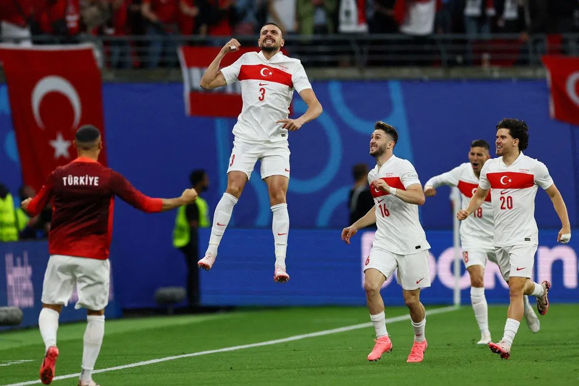 FILE PHOTO: Soccer Football - Euro 2024 - Round of 16 - Austria v Turkey - Leipzig Stadium, Leipzig, Germany - July 2, 2024 Turkey's Merih Demiral celebrates scoring their first goal with Ismail Yuksek and Ferdi Kadioglu REUTERS/Thilo Schmuelgen/File Photo