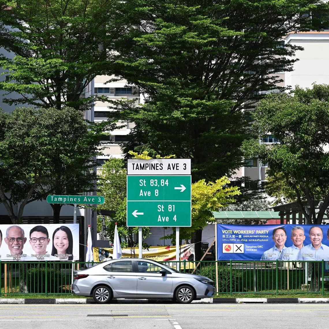 Banners for PAP and WP candidates for Tampines GRC ahead of the 2025 General Election.
