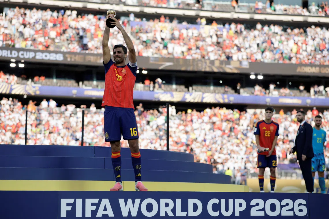 Spain's Rodri celebrates on the podium after winning the Golden Ball following the FIFA World Cup 2026 Final, at New York New Jersey Stadium in East Rutherford, New Jersey, U.S., July 19, 2026. REUTERS/Evan Vucci