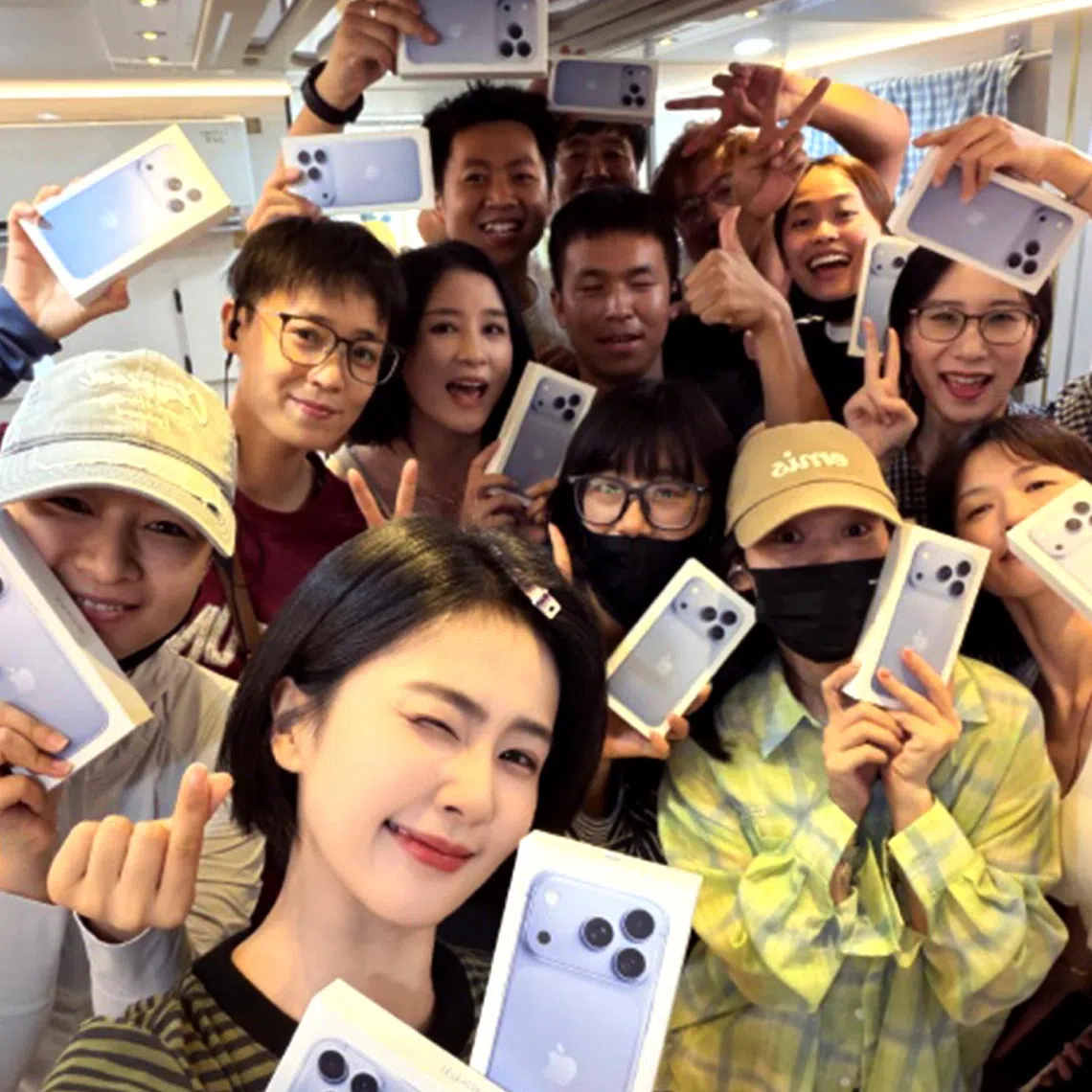 Chinese actress Bai Lu (forefront) gives each of her staff members an iPhone 18.