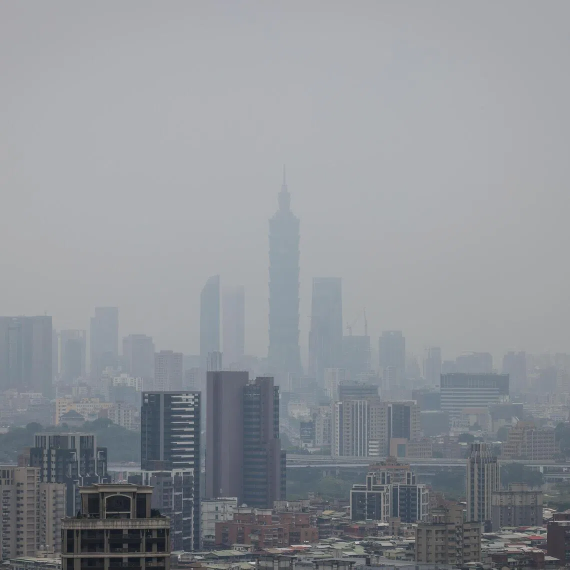 Fog shrouded the skyline of the Xinyi business district in Taipei, Taiwan, on March 24.