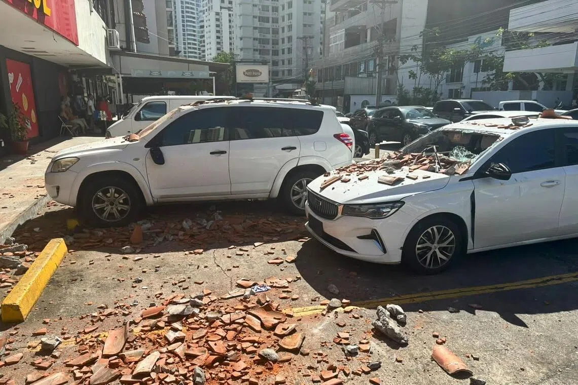 Vehicles damaged by debris in Panama City, on Oct 9, following a 7.7-magnitude earthquake.