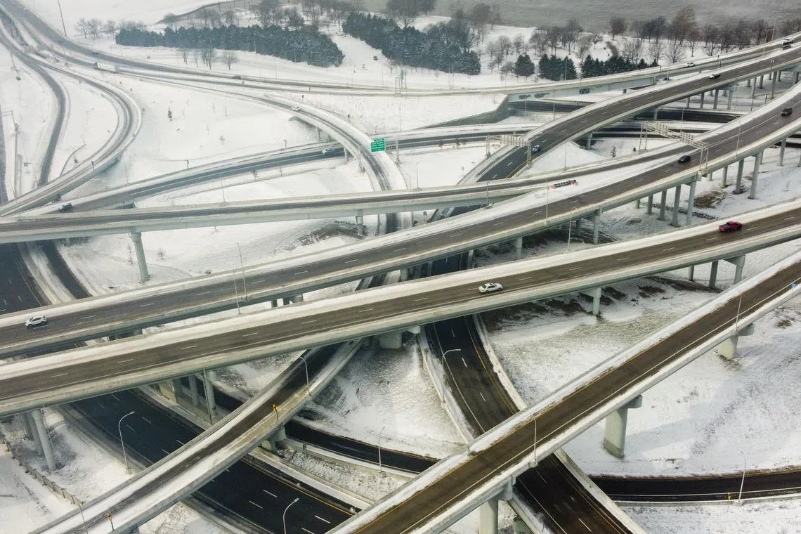 Vehicles move along a highway in Louisville, Kentucky, under freezing temperatures on December 23, 2022.  