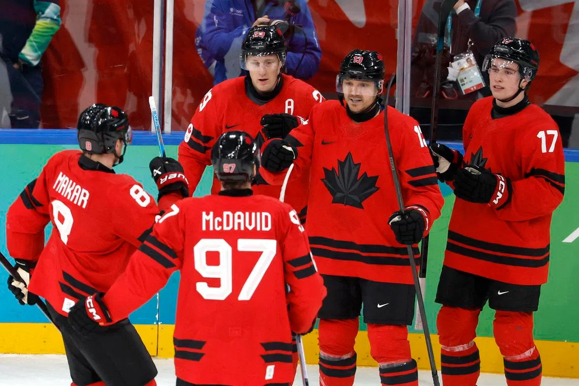 Milano Cortina 2026 Olympics - Ice Hockey - Men's Play-offs Semifinals - Canada vs Finland - Milano Santagiulia Ice Hockey Arena, Milan, Italy - February 20, 2026. Sam Reinhart of Canada celebrates scoring their first goal with teammates. REUTERS/David W Cerny