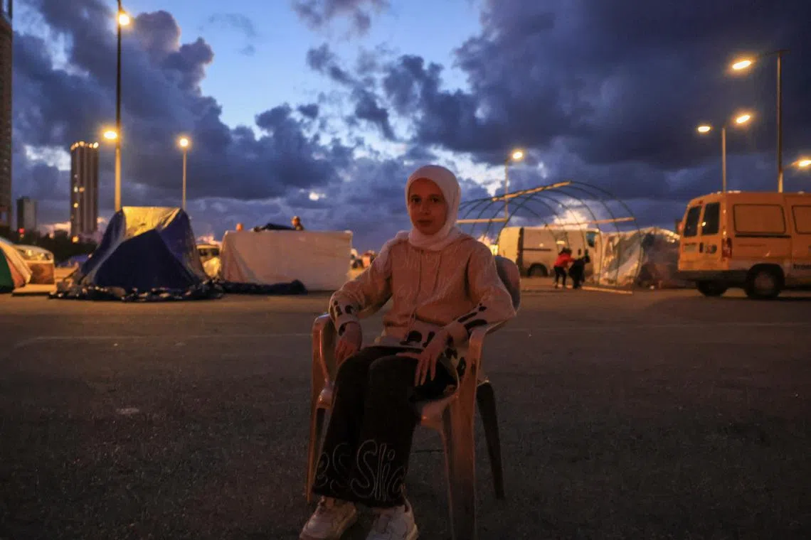 Nariman Al-Issa, 12, a Syrian orphan girl who lost four members of her family during an Israeli strike on Beirut southern suburbs, poses for a photo during an interview with Reuters, at a temporary encampment for displaced people, amid escalating hostilities between Israel and Hezbollah, as the U.S.-Israel conflict with Iran continues, in Beirut, Lebanon, March 30, 2026. REUTERS/Raghed Waked