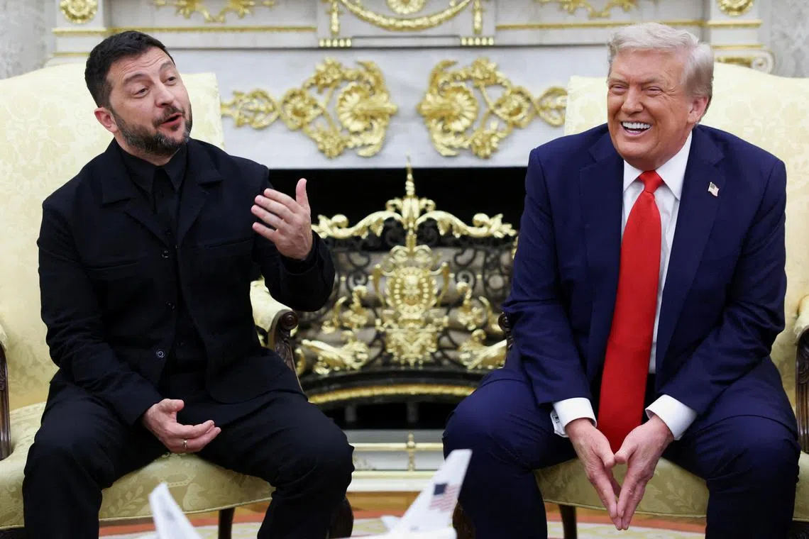 Ukrainian President Volodymyr Zelenskiy gestures as U.S. President Donald Trump reacts during a meeting at the Oval Office of the White House, amid negotiations to end the Russian war in Ukraine, in Washington, D.C., U.S., August 18, 2025. REUTERS/Kevin Lamarque       TPX IMAGES OF THE DAY