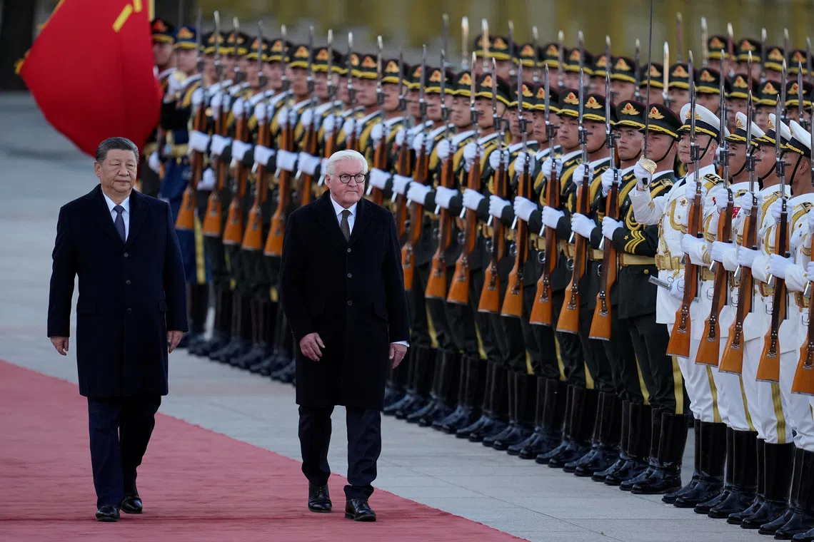 Chinese President Xi Jinping and German President Frank-Walter Steinmeier receive a guard of honor during a welcoming ceremony outside the Great Hall of the People in Beijing, China, October 30, 2026. KYODO NEWS/Kai Naito/Pool via REUTERS