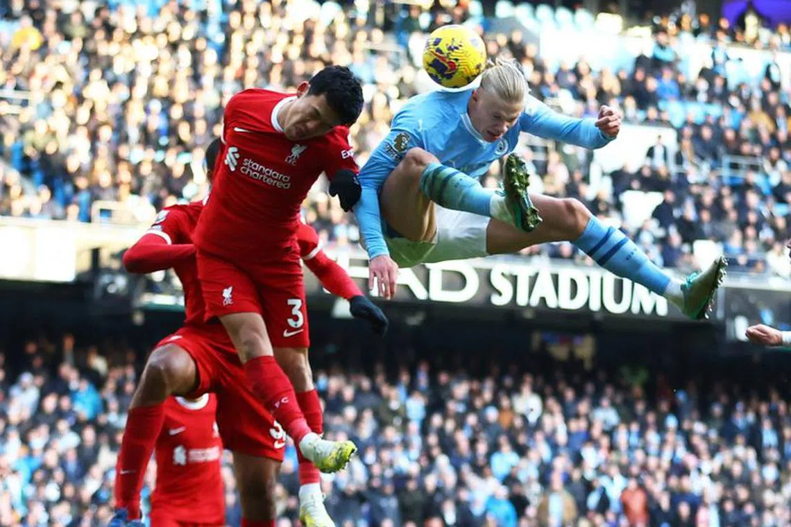 Soccer Football - Premier League - Manchester City v Liverpool - Etihad Stadium, Manchester, Britain - November 25, 2023 Manchester City's Erling Braut Haaland in action with Liverpool's Wataru Endo REUTERS/Carl Recine