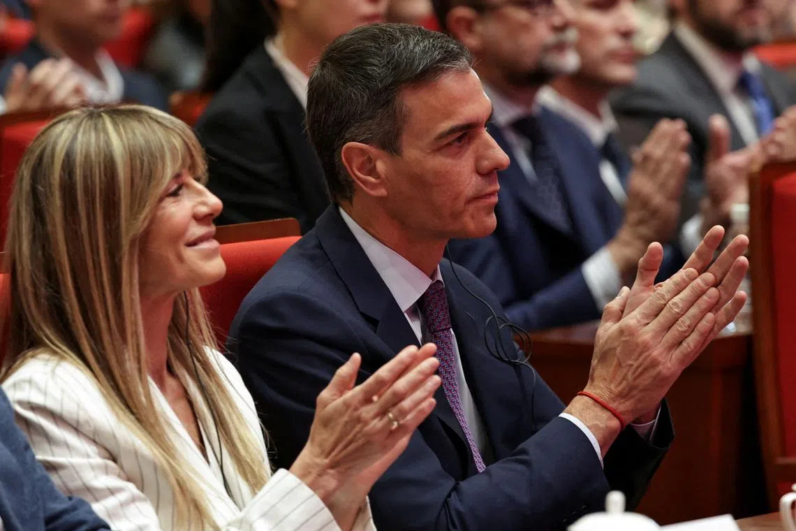 FILE PHOTO: Spanish Prime Minister Pedro Sanchez (R), and his wife Begona Gomez, attend a speech at Tsinghua University, in Beijing, China, 13 April, 2026. Pedro Sanchez is on an official visit to China until 15 April 2026.    ANDRES MARTINEZ CASARES/Pool via REUTERS/File Photo