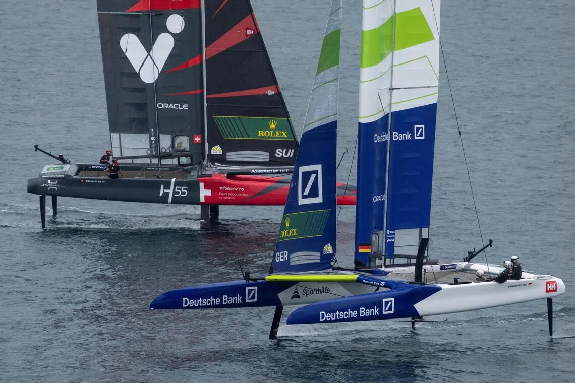 Germany SailGP Team helmed by Erik Heil sailing past Switzerland SailGP Team piloted by Sebastien Schneiter at Switzerland Sail Grand Prix in Geneva on Sept 21, 2025.