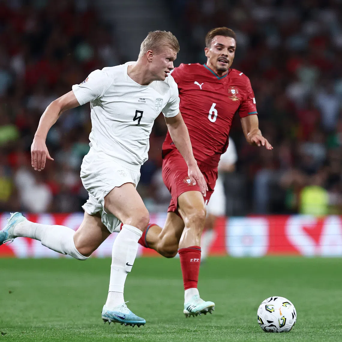 Soccer Football - Nations League - Group A4 - Portugal v Norway - Estadio do Dragao, Porto, Portugal - October 4, 2026 Norway's Erling Haaland in action with Portugal's Joao Palhinha REUTERS/Rodrigo Antunes