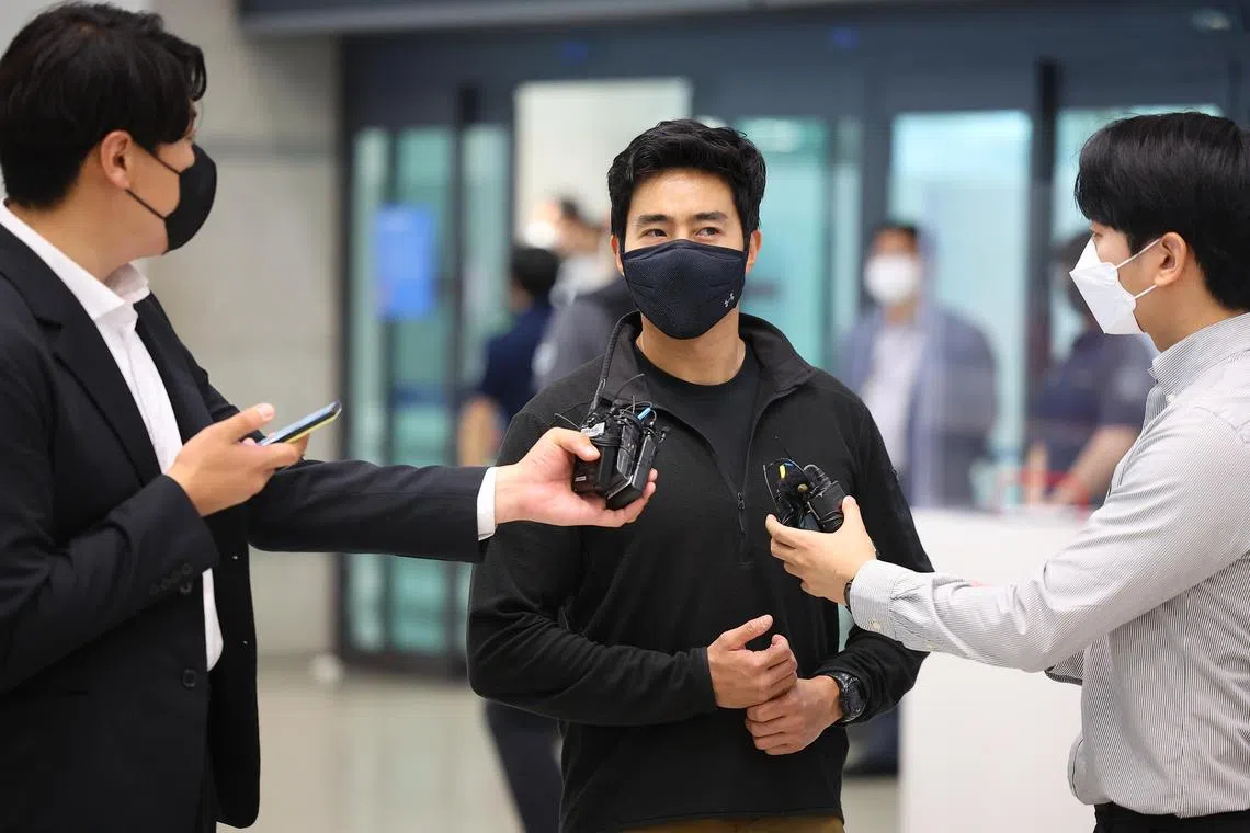 South Korean volunteer fighter Rhee Keun speaking to the media after arriving at Incheon Airport on May 27, 2022.