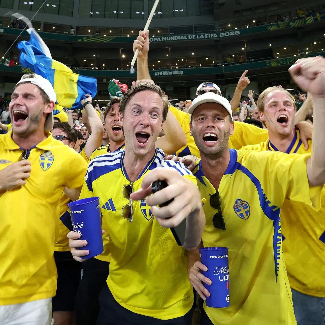 Sweden's fans celebrate after their team won the 2026 World Cup Group F football match with Tunisia.
