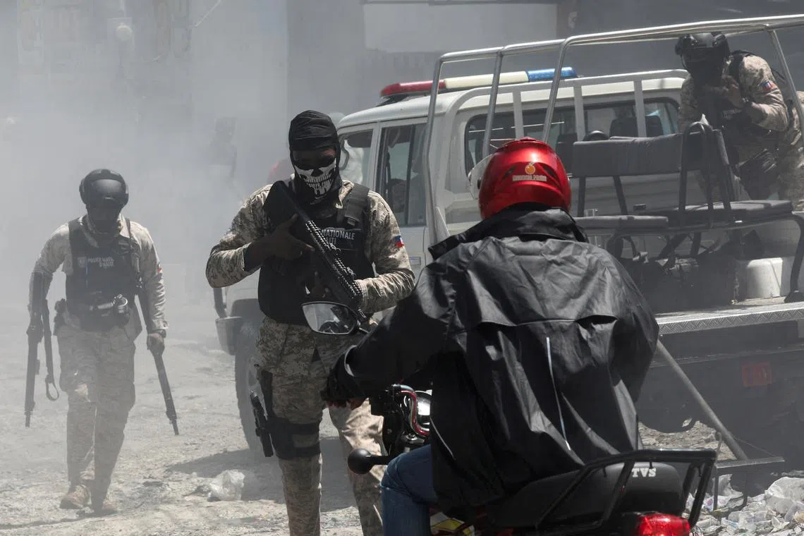 FILE PHOTO: Police officers patrol after dispersing demonstrators, who were calling for help from the government and security forces after gangs attacked neighbourhoods and set houses on fire, in Port-au-Prince, Haiti August 19, 2024. REUTERS/Ralph Tedy Erol/File Photo