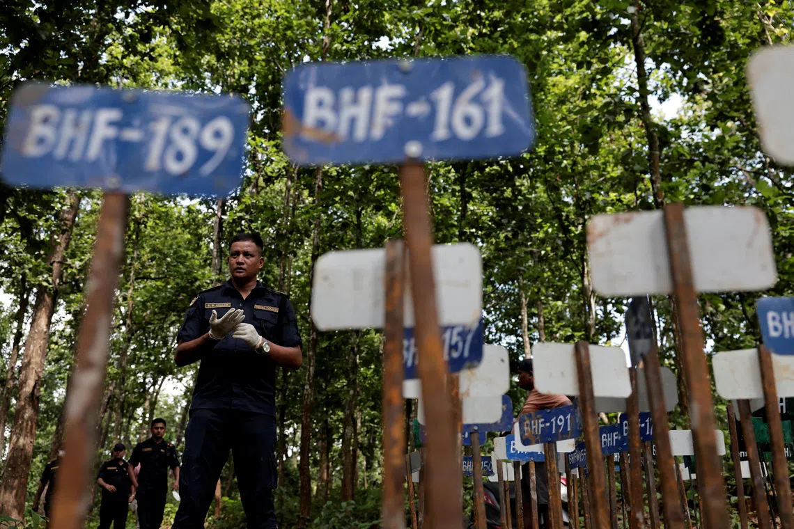 Nepal begins mass burials of unidentified flood victims as families seek missing