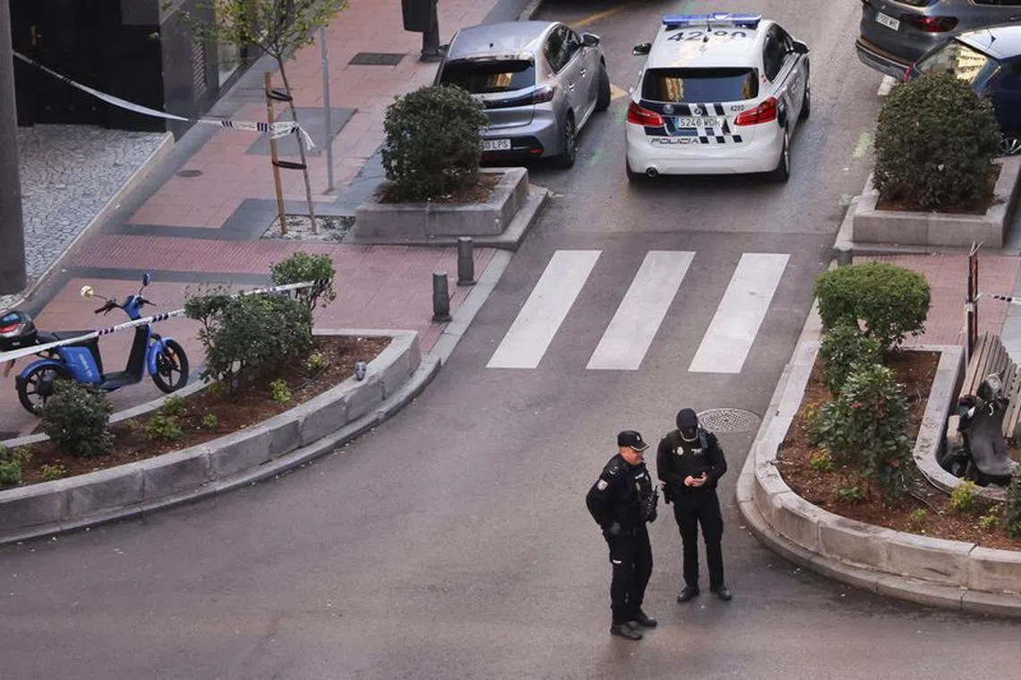 Police work at the site where Alejo Vidal-Quadras was shot in the face, in Madrid.