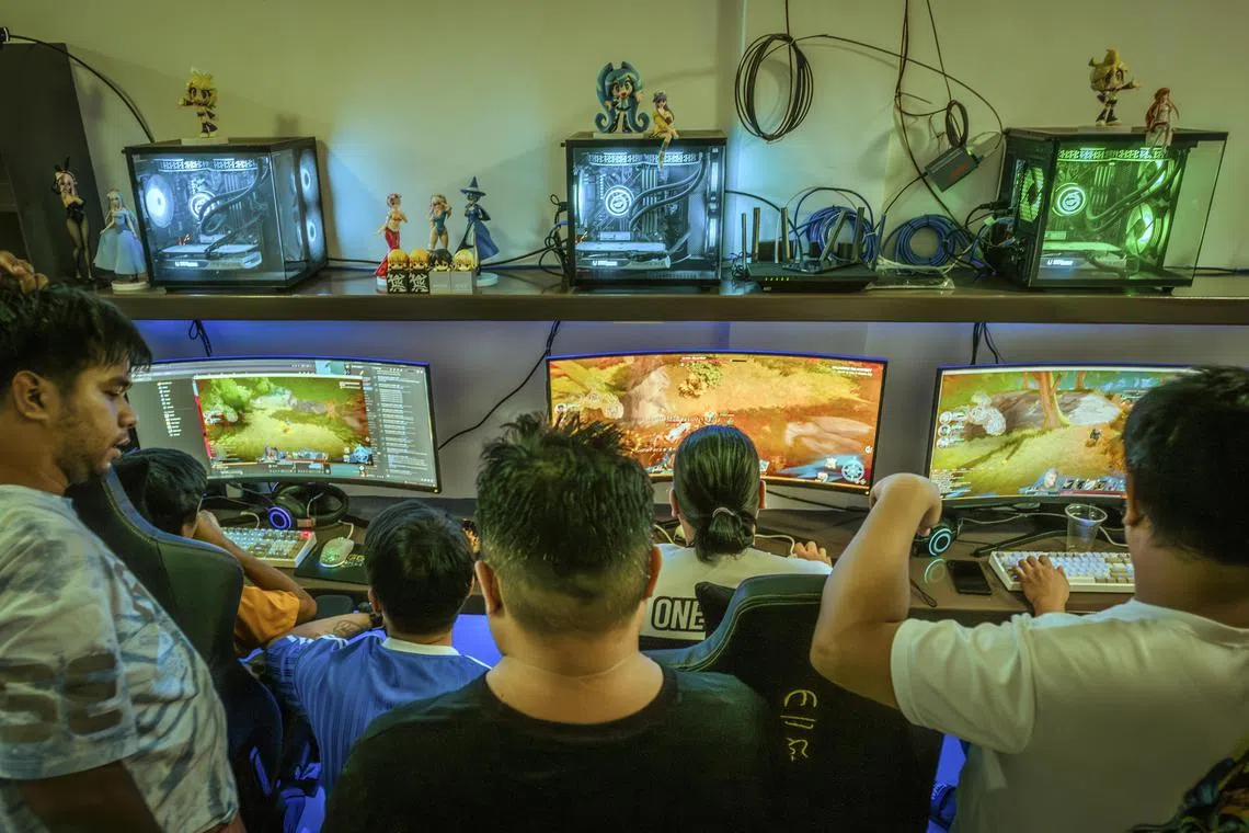 Customers at NAFT X Street, an internet cafe in Quezon City, Philippines.  New internet cafeasare a sign of how crypto has begun booming again in the Philippines. 