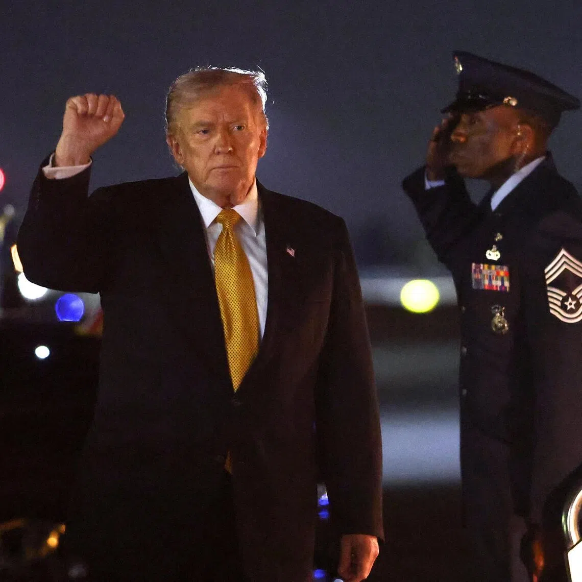 US President Donald Trump pumping his fist on Nov 7, as he arrives in Florida aboard Air Force One for the weekend.