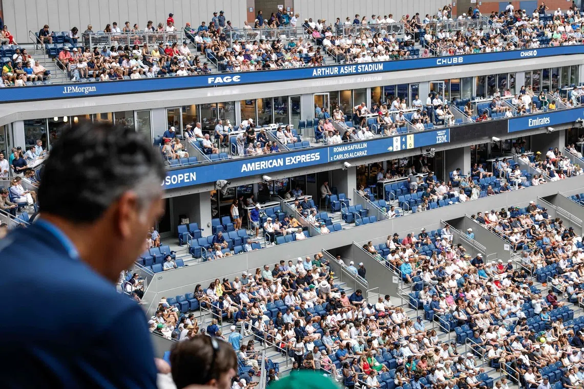 Fans attend the US Open at the Arthur AShe Stadium in New York on Aug 31.