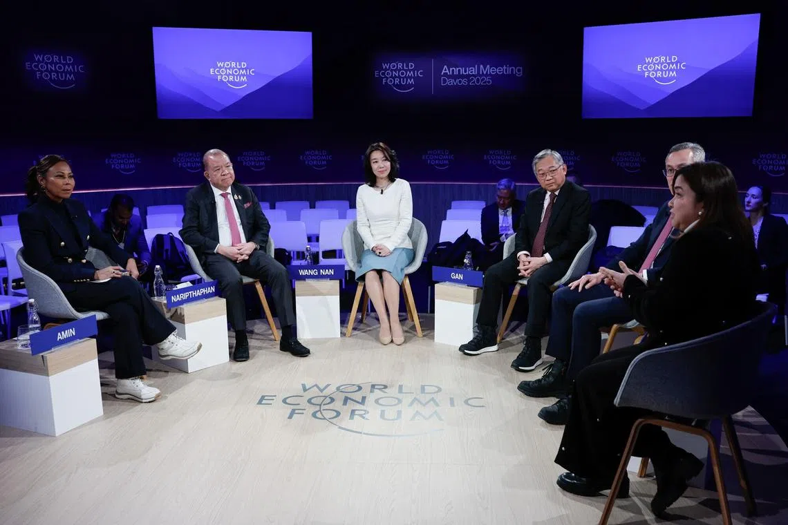 (From left) Bloomberg anchor Haslinda Amin, Thailand commerce minister Pichai Naripthaphan, Neusoft senior vice-president Wang Nan, Singapore Deputy Prime Minister Gan Kim Yong Baker McKenzie global chair Milton Cheng and Mynt CEO Martha Sazon during a WEF panel session on Jan 21. 