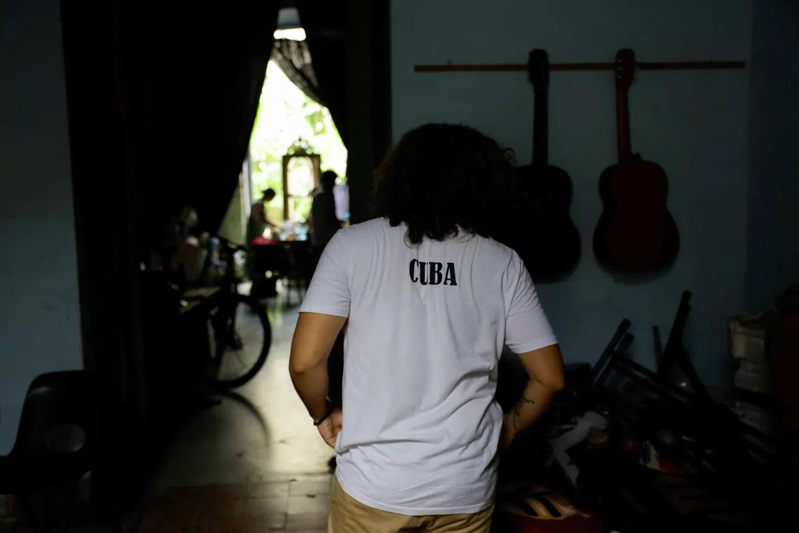 An actor from the Impulso Teatro theater group rehearses in a dimly lit dressing room before an evening performance staged without electricity, as daily blackouts pose severe challenges for local theater groups and the performing arts, in Havana, Cuba, October 2, 2026. REUTERS/Norlys Perez