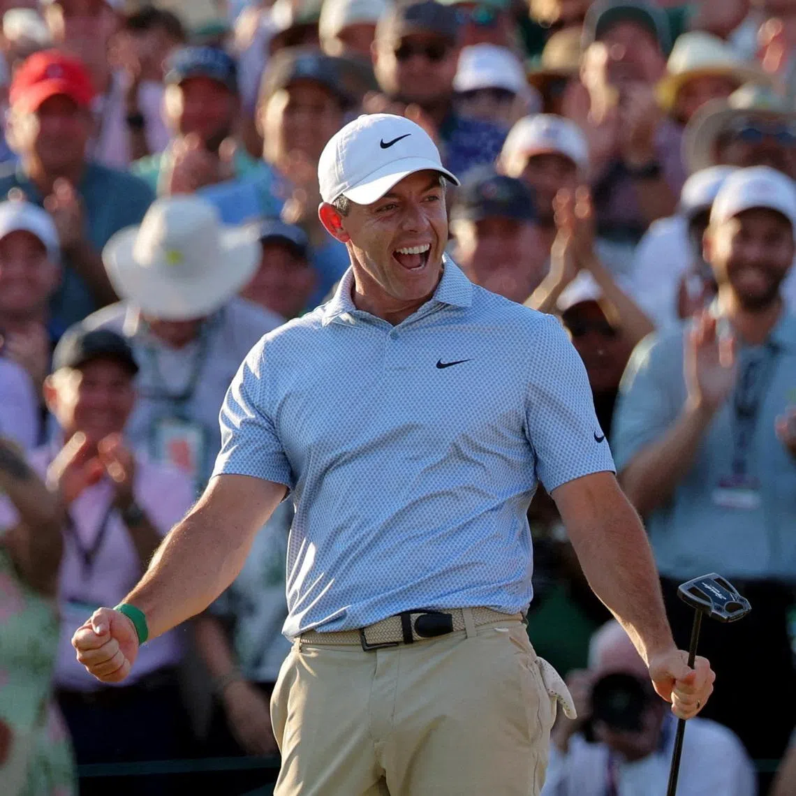 Golf - The Masters - Augusta National Golf Club, Augusta, Georgia, U.S. - April 12, 2026 Northern Ireland's Rory McIlroy celebrates on the green on the 18th hole after winning The Masters REUTERS/Mike Segar