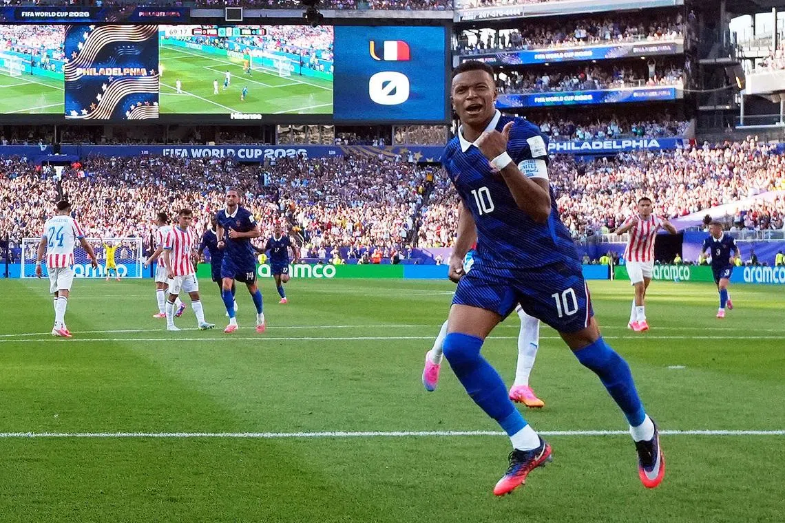 France’s Kylian Mbappe celebrates scoring against Paraguay.