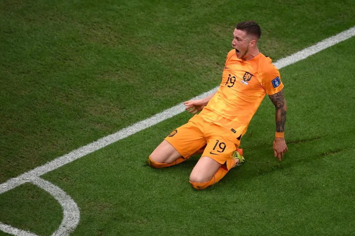 Netherlands forward Wout Weghorst celebrates after he scored against Argentina at the Qatar World Cup.