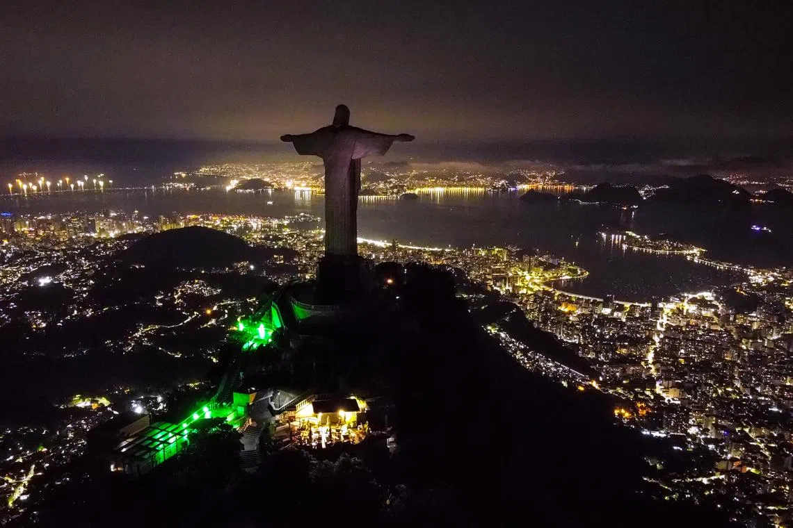 epa10543605 An aerial image taken by a drone shows an unlit Christ the Redeemer statue, in Rio de Janeiro, Brazil, 25 March 2023. The famous monument had its lights shut off in support of Earth Hour 2023, organized by the World Wildlife Fund (WWF), with the goal of bringing attention to the climatic crisis. EPA-EFE/Andre Coelho