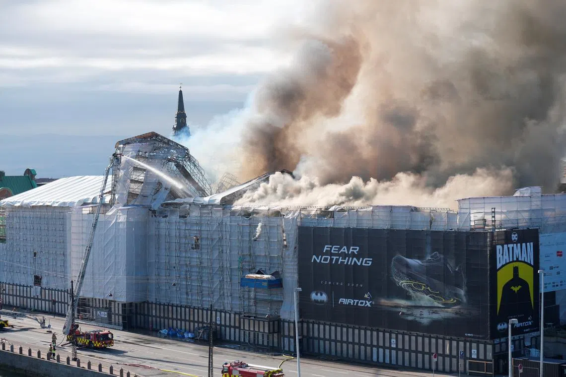 Smoke billows following a fire at the Old Stock Exchange, Boersen, in Copenhagen, Denmark April 16, 2024.  Ritzau Scanpix/Emil Helms/via REUTERS