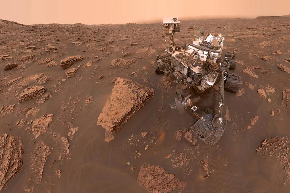 Nasa's Curiosity rover surveys the martian surface in this file photo from 2020.
