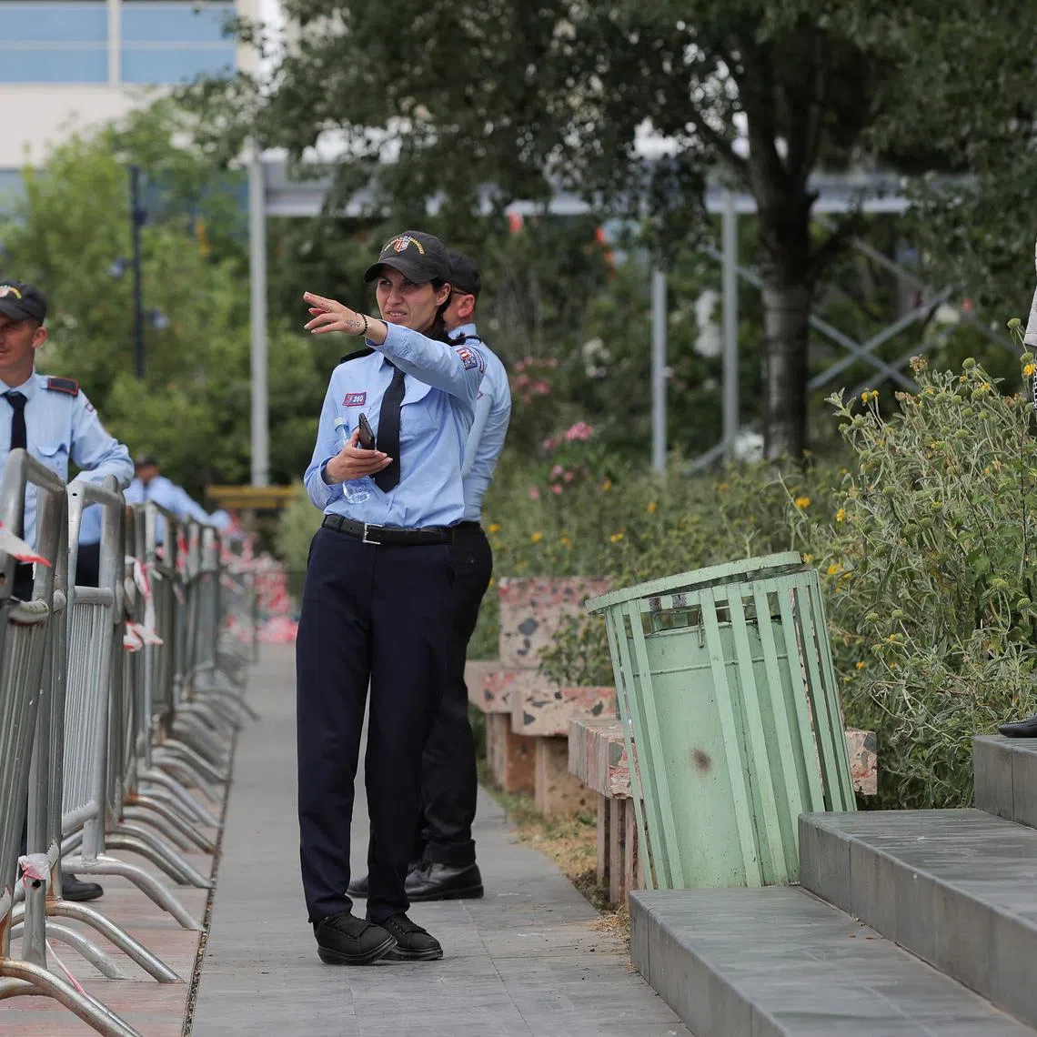 Police officers stand guard near barriers at the Skanderbeg square ahead of the European Political Community Summit in Tirana, Albania May 15, 2025. REUTERS/Valdrin Xhemaj