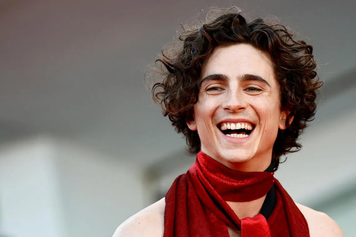 FILE PHOTO: The 79th Venice Film Festival - Premiere screening of the film "Bones and All" in competition - Red Carpet Arrivals - Venice, Italy, September 2, 2022. Cast member Timothee Chalamet poses. REUTERS/Yara Nardi/File Photo