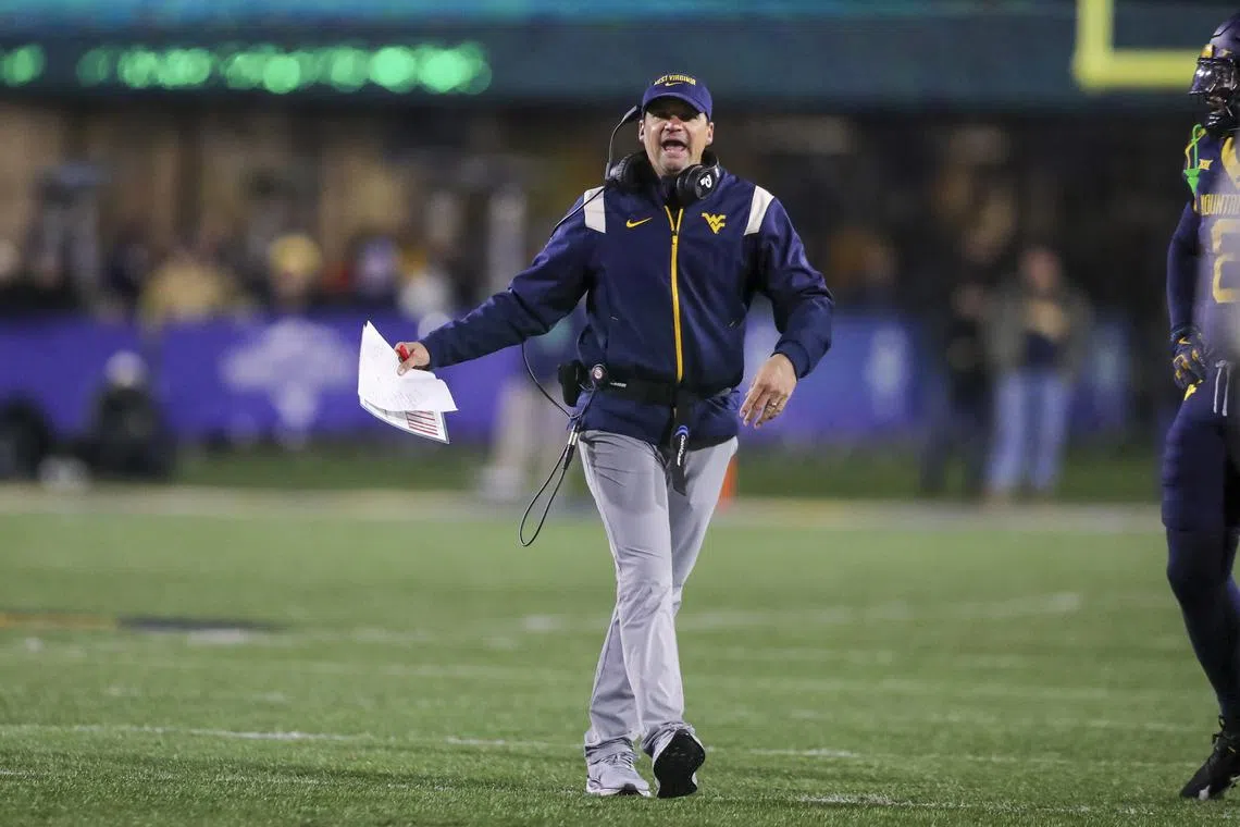 FILE PHOTO: Nov 23, 2024; Morgantown, West Virginia, USA; West Virginia Mountaineers head coach Neal Brown argues a call during the fourth quarter against the UCF Knights at Mountaineer Field at Milan Puskar Stadium. Ben Queen-Imagn Images/File Photo