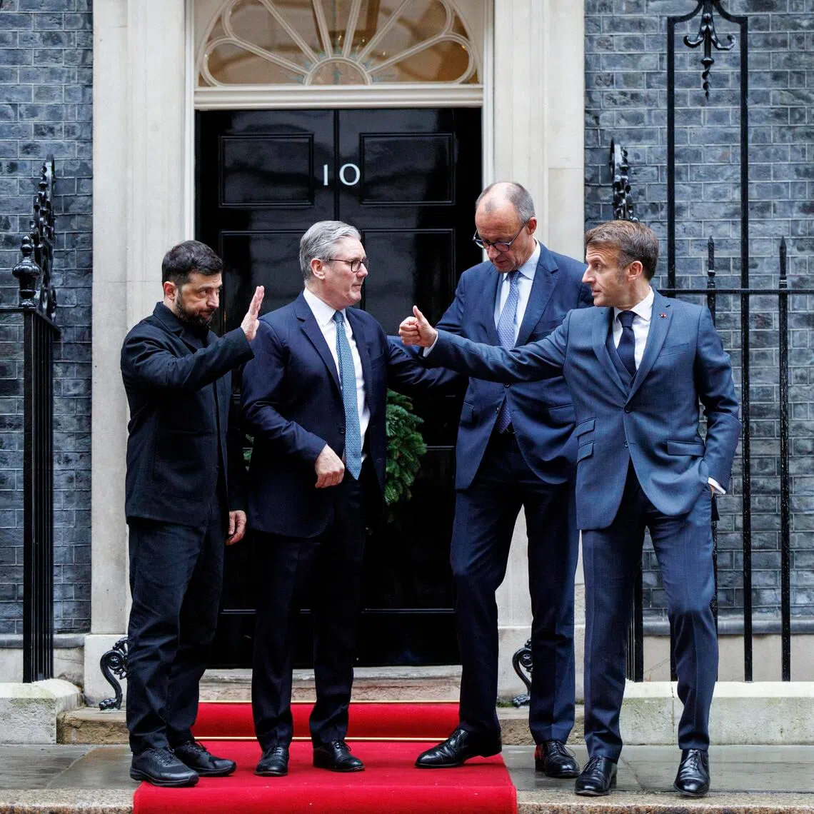 (From left) Ukrainian President Volodymyr Zelensky, British Prime Minister Keir Starmer, German Chancellor Friedrich Merz and French President Emmanuel Macron  after a Dec 8 meeting of the Coalition of the Willing in London.