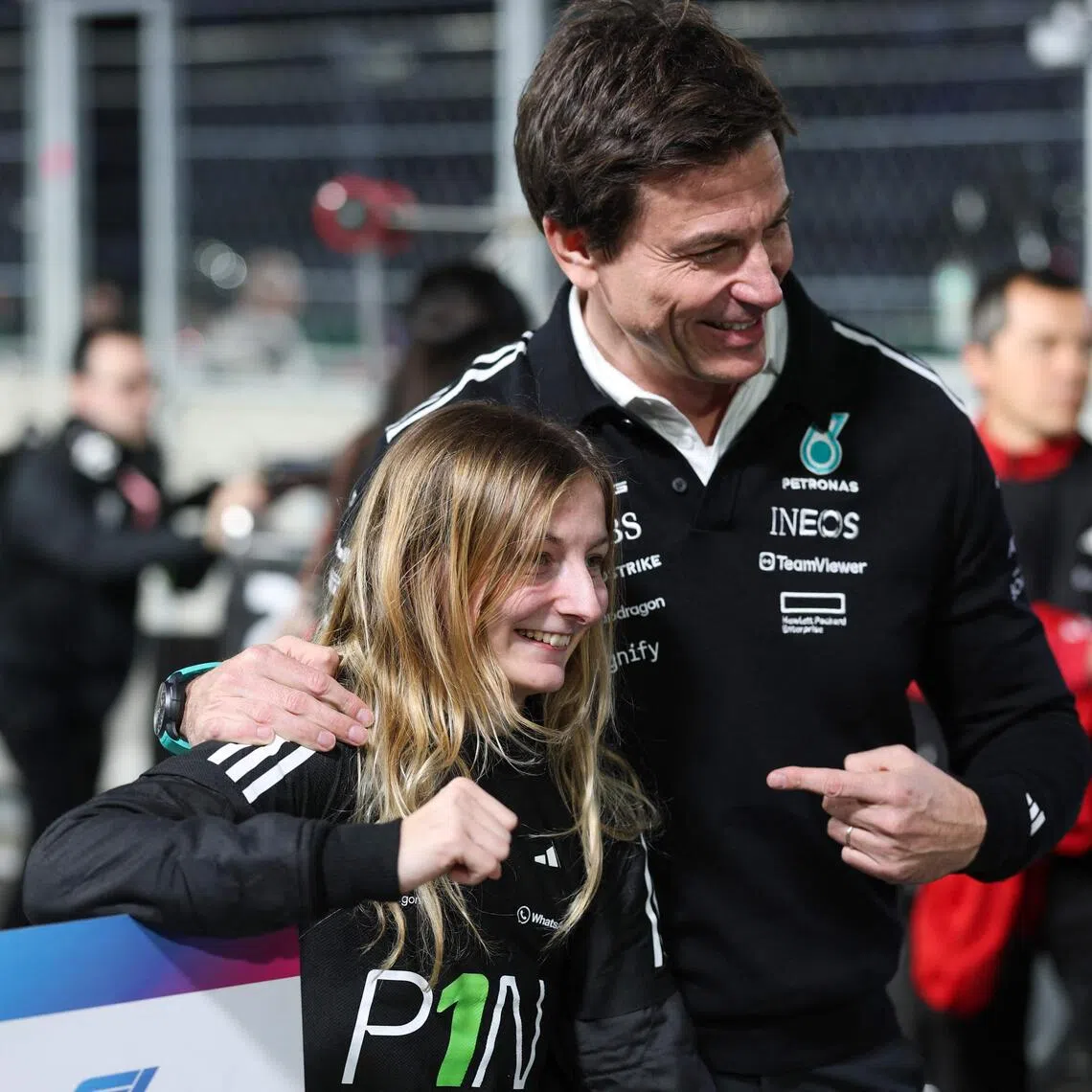 French driver Doriane Pin celebrates her 2025 F1 Academy drivers' championship victory with Mercedes' Austrian team principal and CEO Toto Wolff after the F1 Academy race at the Las Vegas Strip Circuit in Nevada, on Nov 22, 2025.