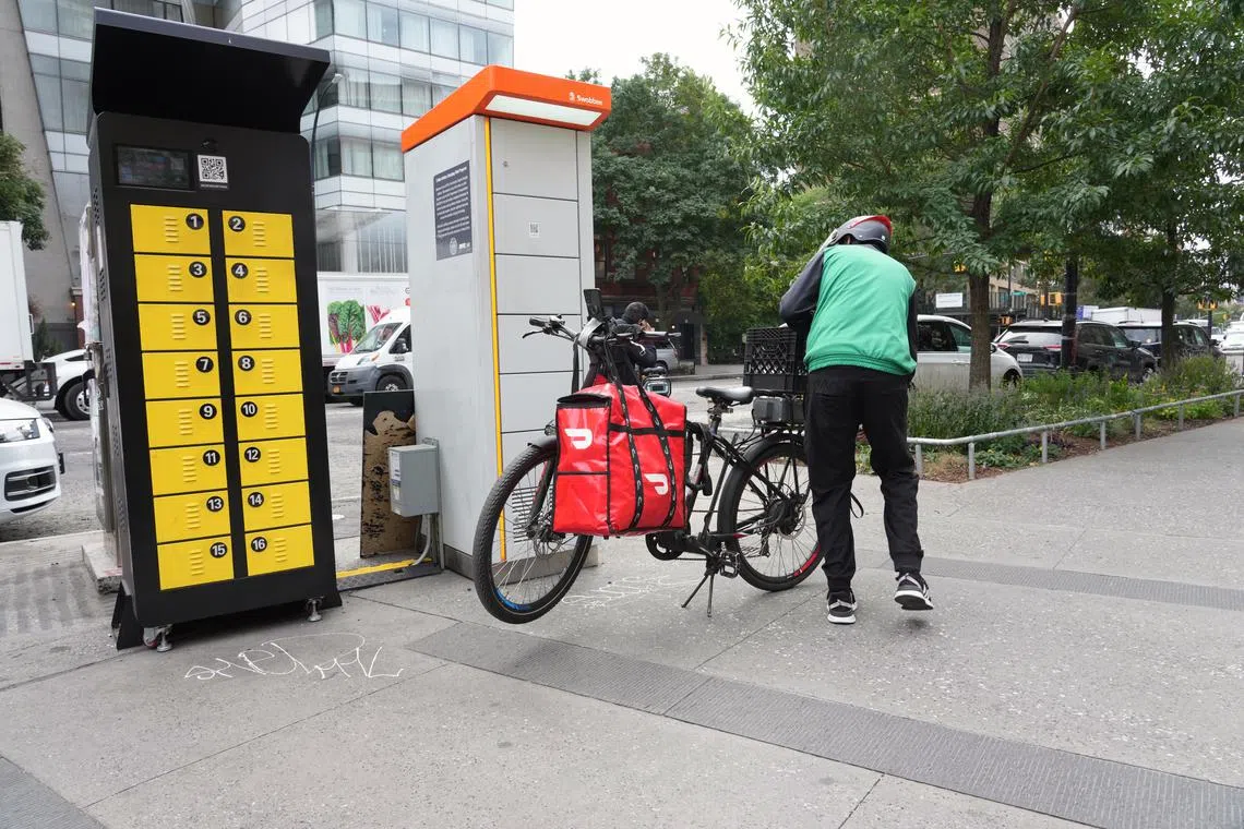 FILE — E-bike battery charging stations in New York, on Sept. 22, 2024. Lithium battery fires are still occurring at the same pace as last year but the rate of injuries and deaths from them has slowed, with three deaths and 84 injuries so far this year, down from 14 deaths and 114 injuries during the same period in 2023. (Michelle V. Agins/The New York Times)   