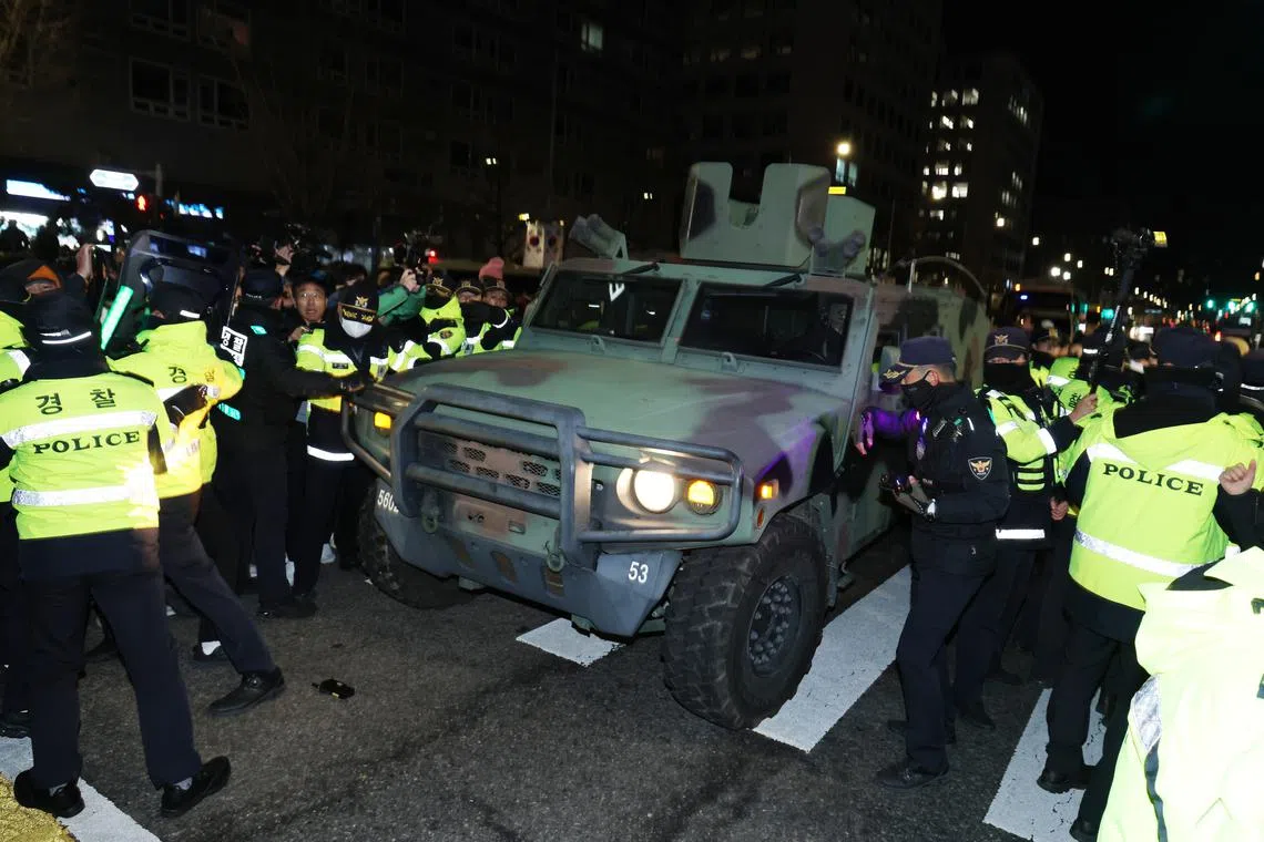 Soldiers and military vehicles outside the National Assembly in Seoul after South Korean President Yoon Suk Yeol declared martial law.