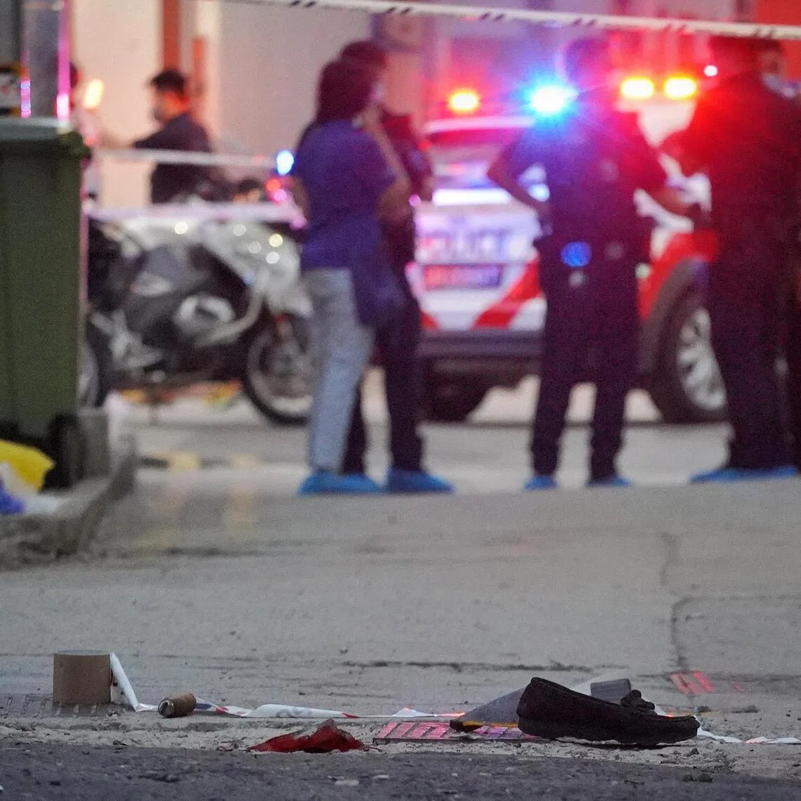 Investigators near the scene of the Beach Road slashing on Apr 14, 2022. 