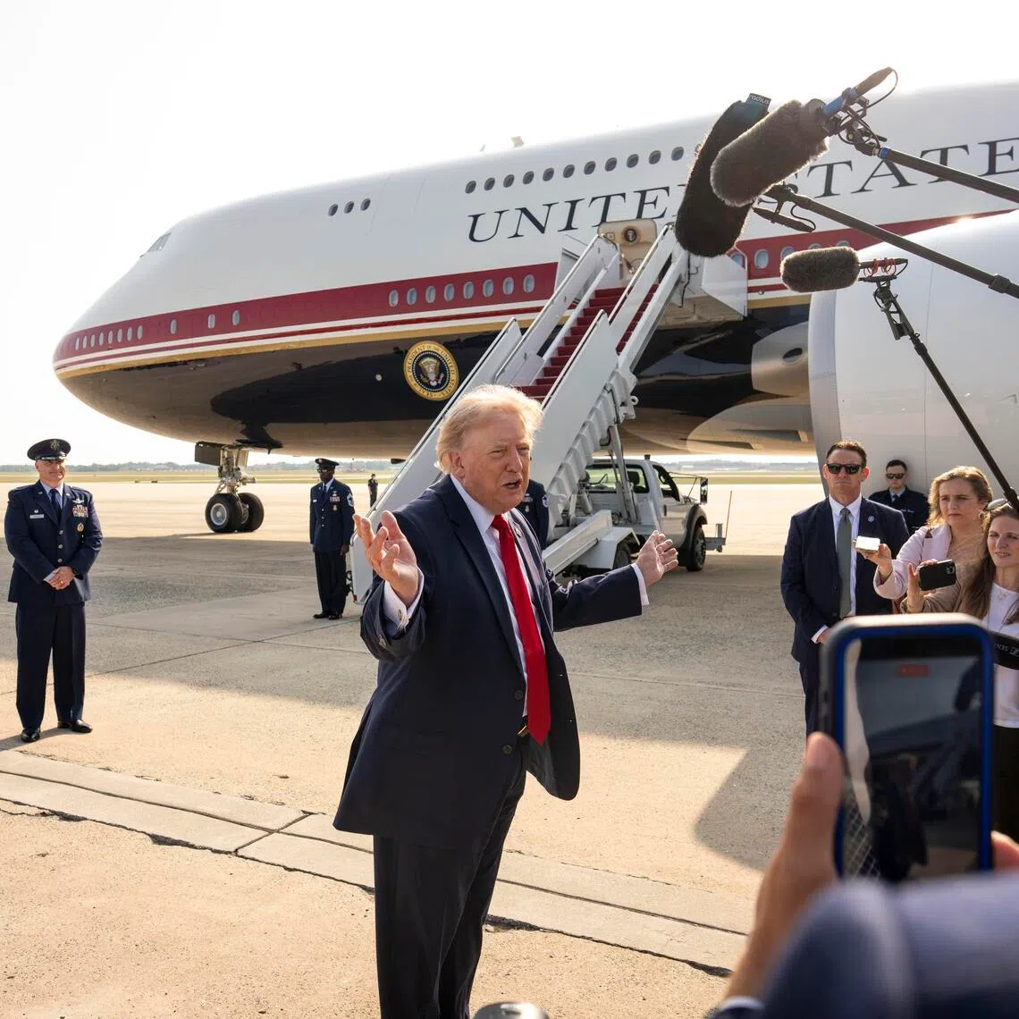US President Donald Trump speaks to reporters before boarding the new Air Force One at Joint Base Andrews on July 1.