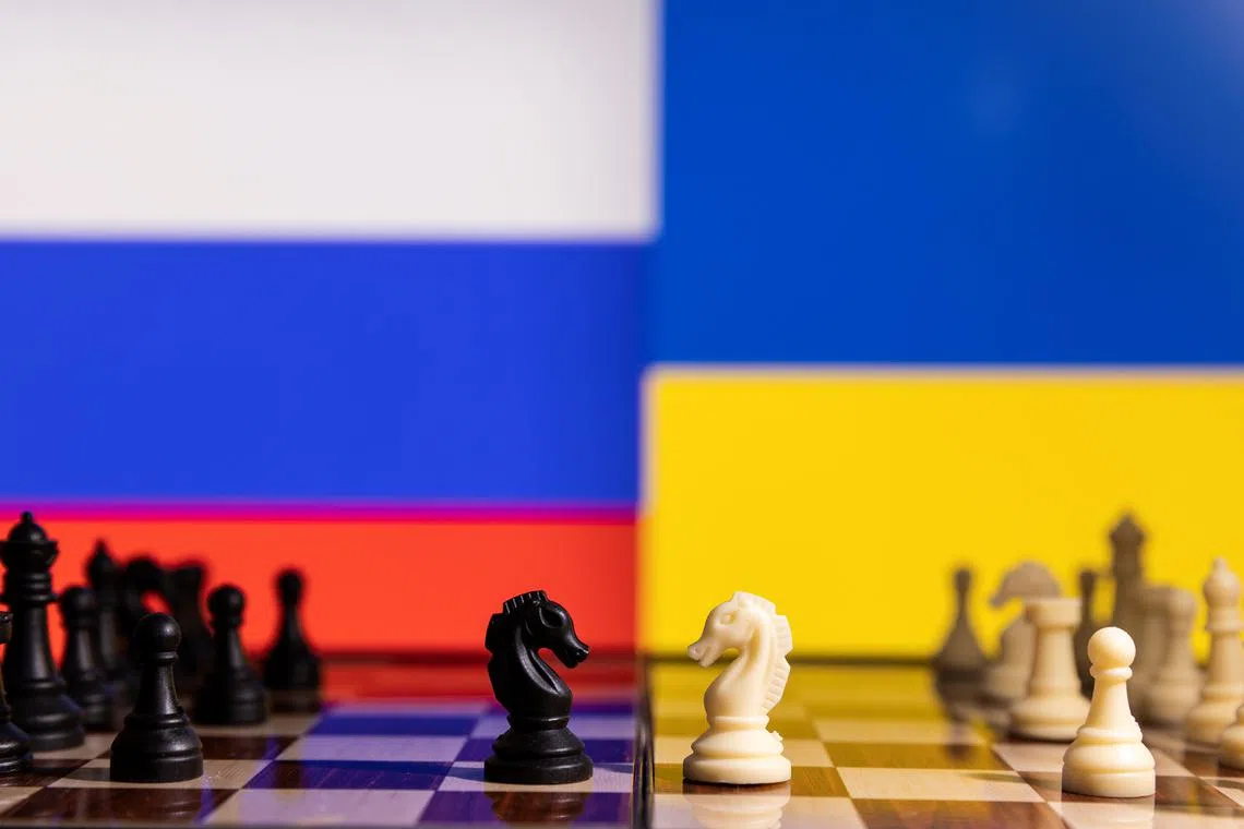 FILE PHOTO: Chess pieces are seen in front of displayed Russia and Ukraine's flags in this illustration taken January 25, 2022. REUTERS/Dado Ruvic/Illustration/File Photo