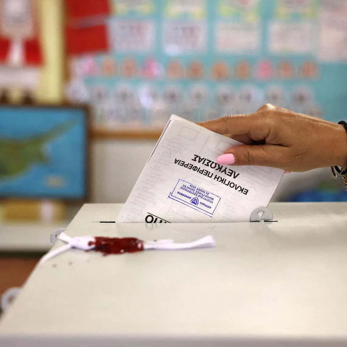 A woman casts her vote during parliamentary elections at a polling station in Nicosia, Cyprus May 24, 2026. REUTERS/Yiannis Kourtoglou