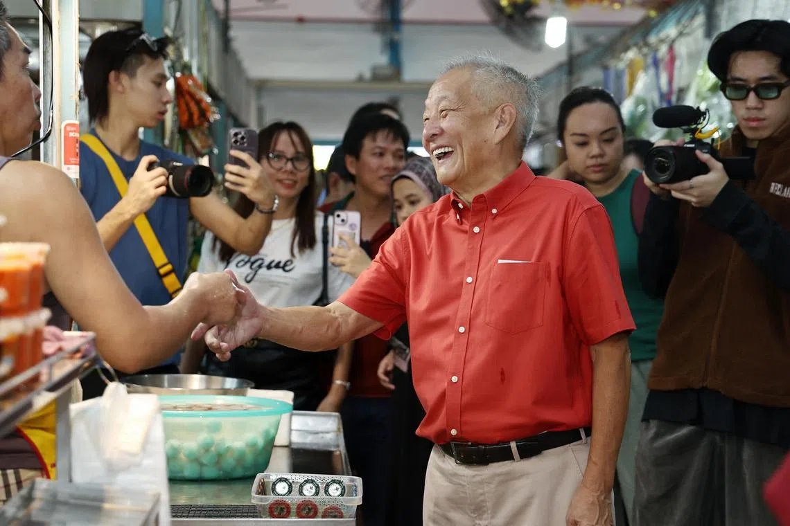 Mr Ng Kok Song and his team interacting with residents and stallholders at The Marketplace@58, New Upper Changi Road, on Aug 11, 2023.
