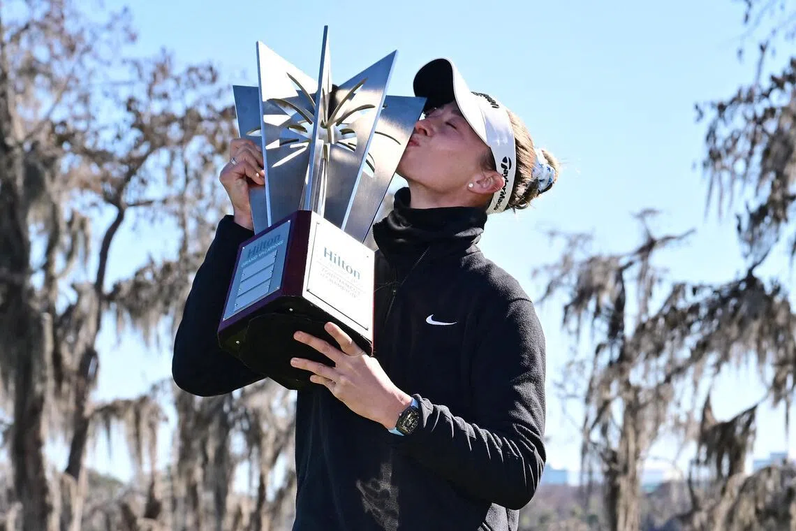Nelly Korda of the United States poses with the trophy following the completion of the third round of the Tournament of Champions 2026 at Lake Nona Golf & Country Club.