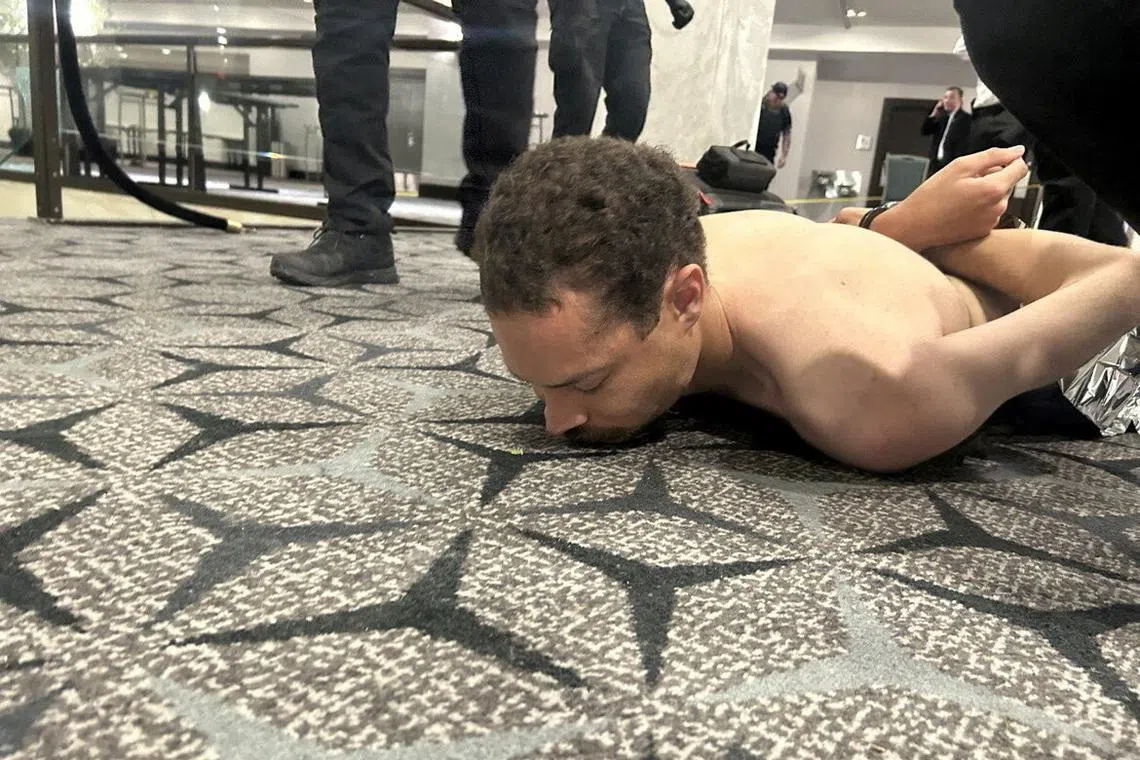 Law enforcement personnel detaining Cole Tomas Allen, a suspect in the shooting incident at the White House Correspondents' Association dinner, on April 25.
