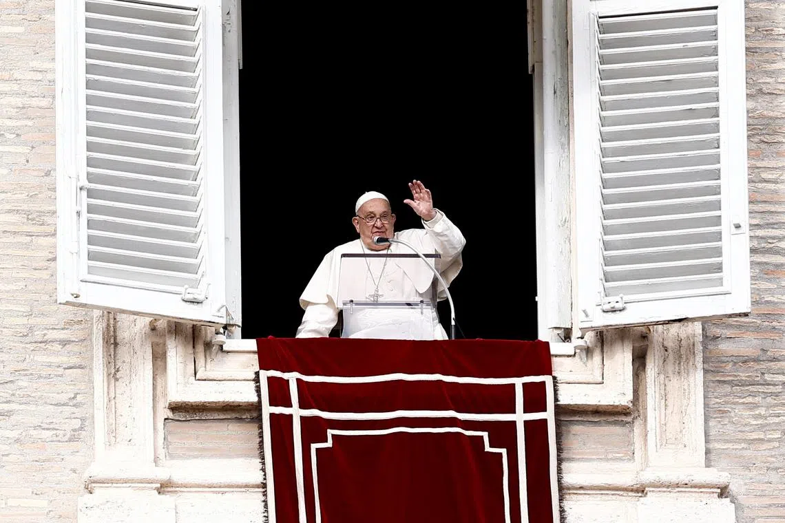 Pope Francis leads the Angelus prayer from his window at the Vatican, January 6, 2025. REUTERS/Guglielmo Mangiapane