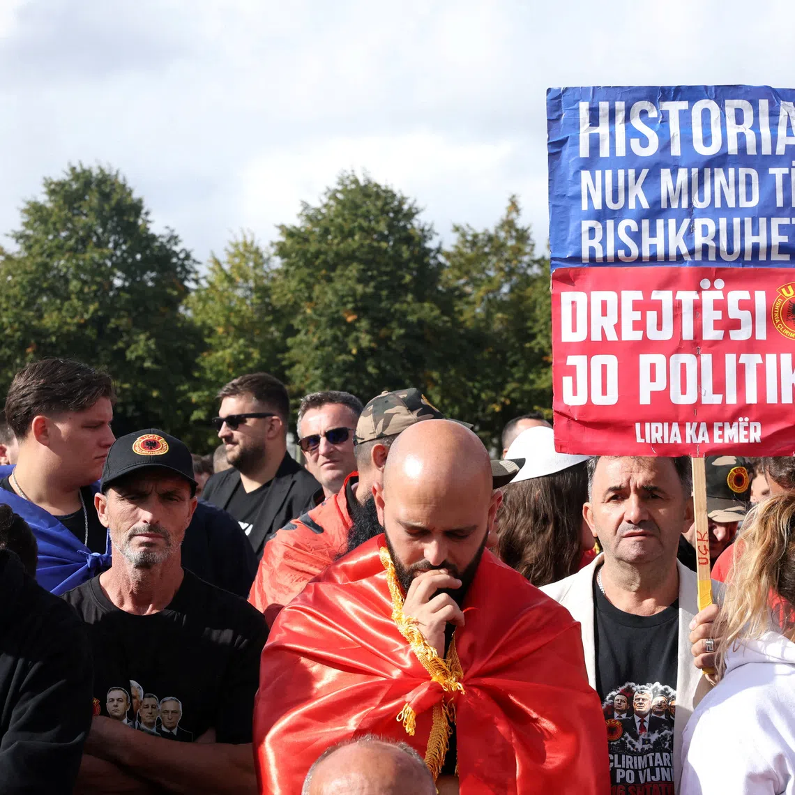 Supporters of former Kosovo President Hashim Thaci react after he was found guilty of war crimes by the Kosovo war crimes tribunal, in The Hague, Netherlands, September 16, 2026. REUTERS/Omar Havana